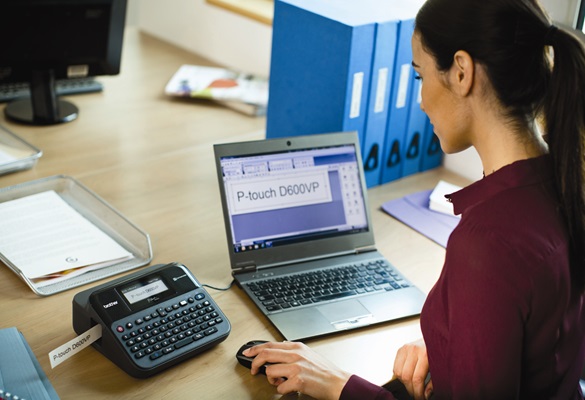 Lady using Brother PT-D600 label printer